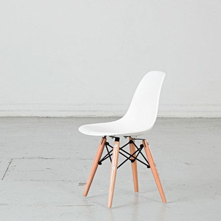 Kids plastic chair with wood-and-metal legs from caramel and sun, Dubai, UAE, left view