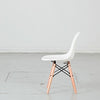 Kids plastic chair with wood-and-metal legs from caramel and sun, Dubai, UAE, left side